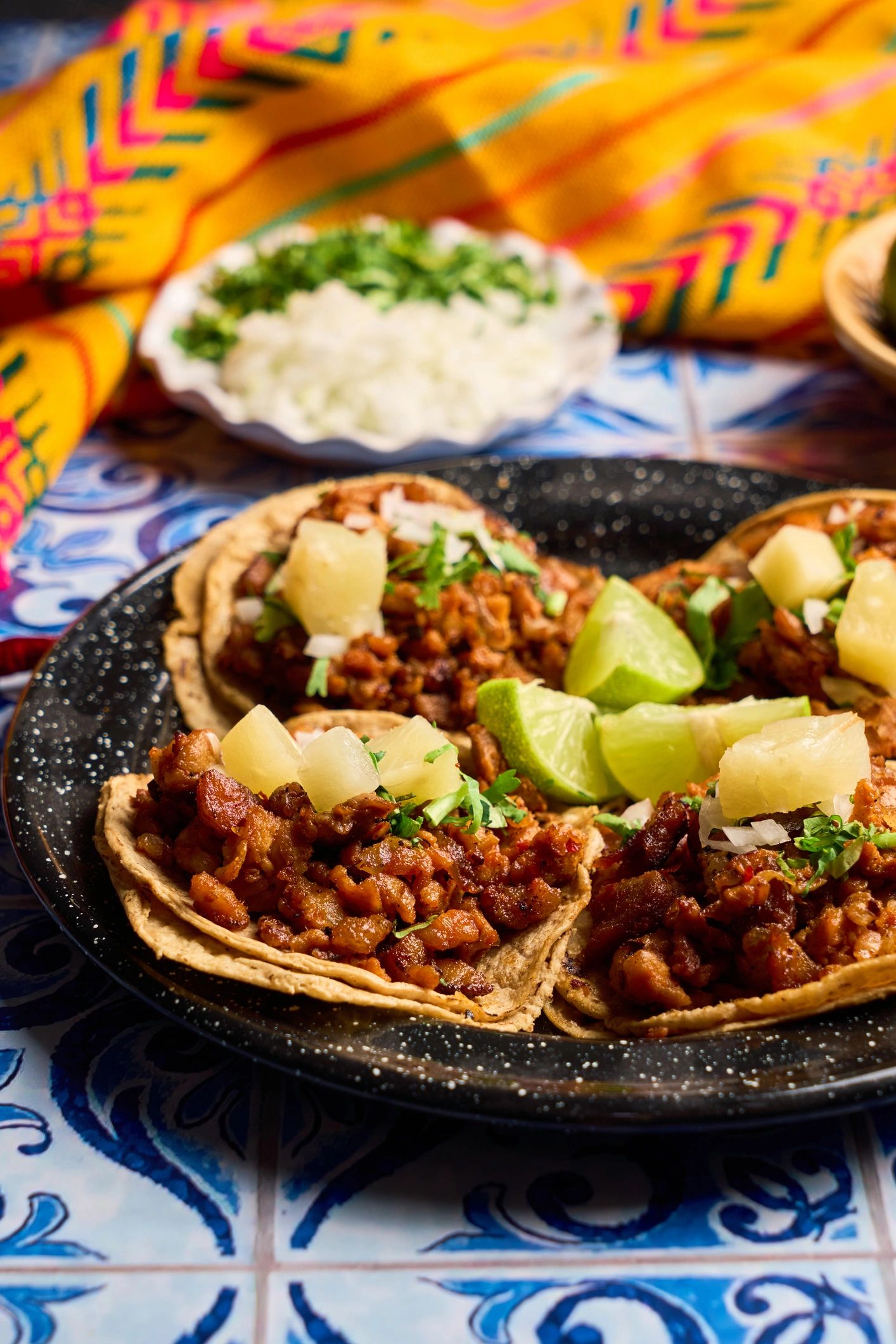 Colorful plate of tacos with fresh toppings